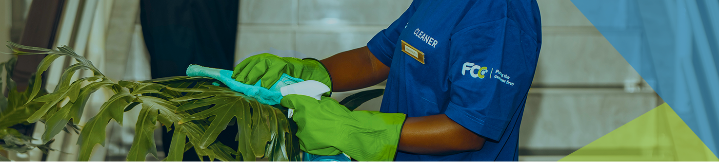 Cleaning professionals wearing masks and gloves